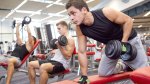 Three men working out in the gym with different exercises