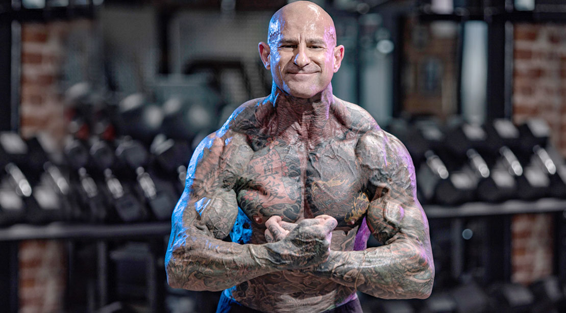 Fitness expert and PHD Dr. Jim Stoppani flexing his muscles in the gym