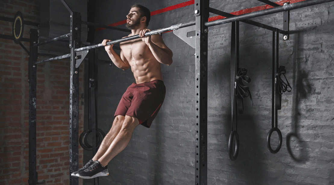 Muscular-Fit-Man-Working-Out-Without-A-Shirt-Doing-Plyometric-Pull-Ups for a weekend workout