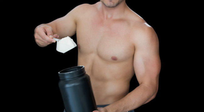 man with protein powder supplement