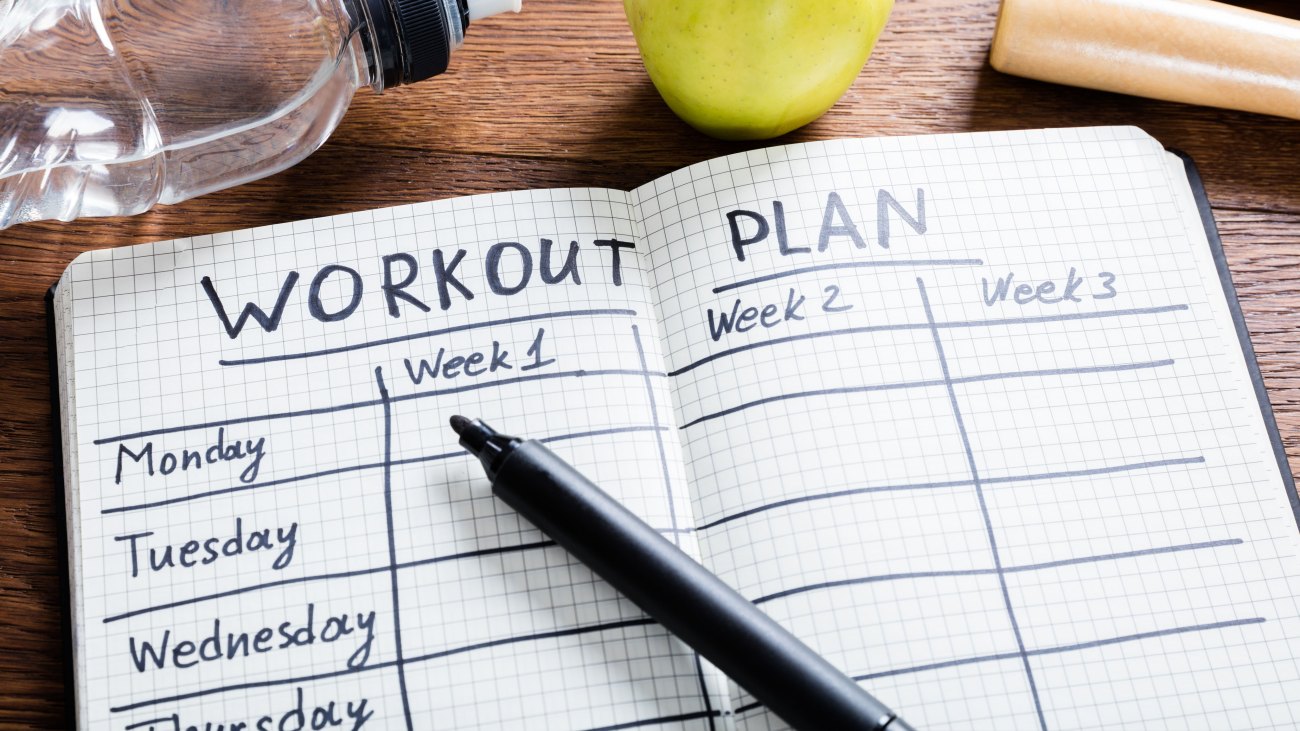 A workout plan notebook for your exercises to keep your fitness resolutions