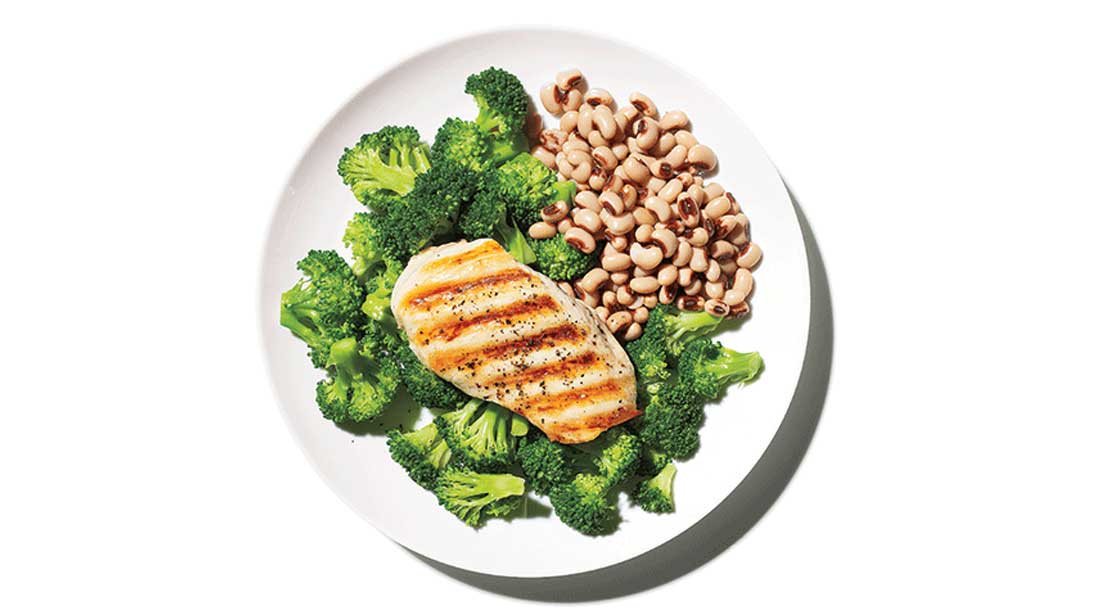 plate of chicken breast, broccoli and black eyed peas