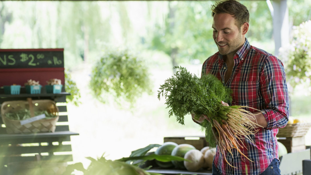 man holding healthy vegetables