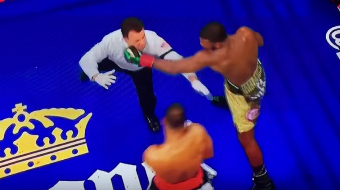 Watch: Boxer nearly knocks out referee, then saves him from crashing to the canvas