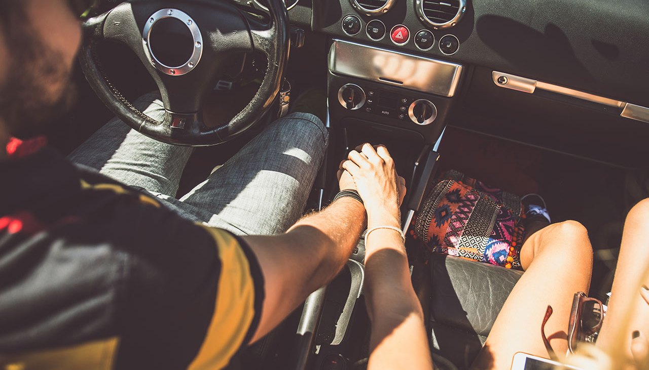Couple Holding Hands In Car