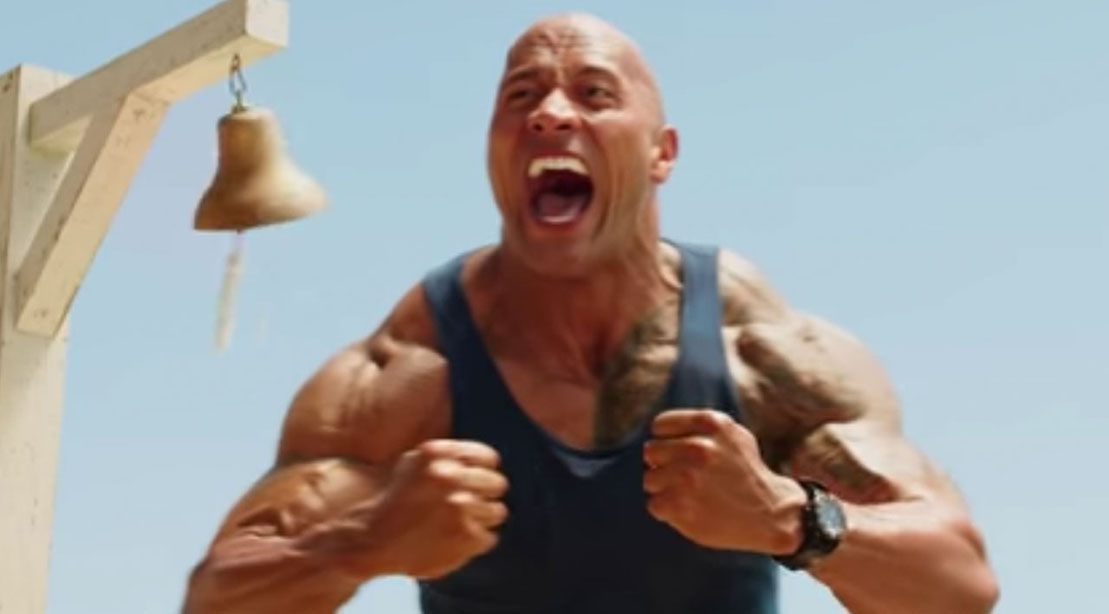 Watch: The Rock as an ‘Oceanic Motherf***Er’ With His Own Jacked Sand Castle in The New 'Baywatch' Trailer