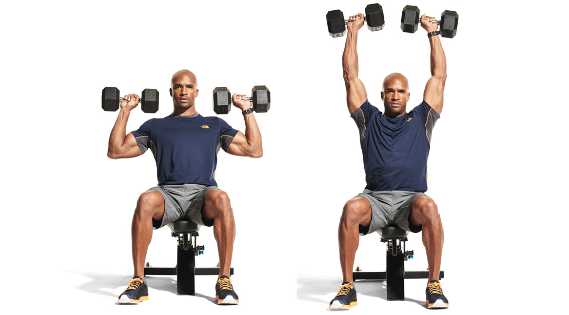 man performing seated dumbbell overhead press