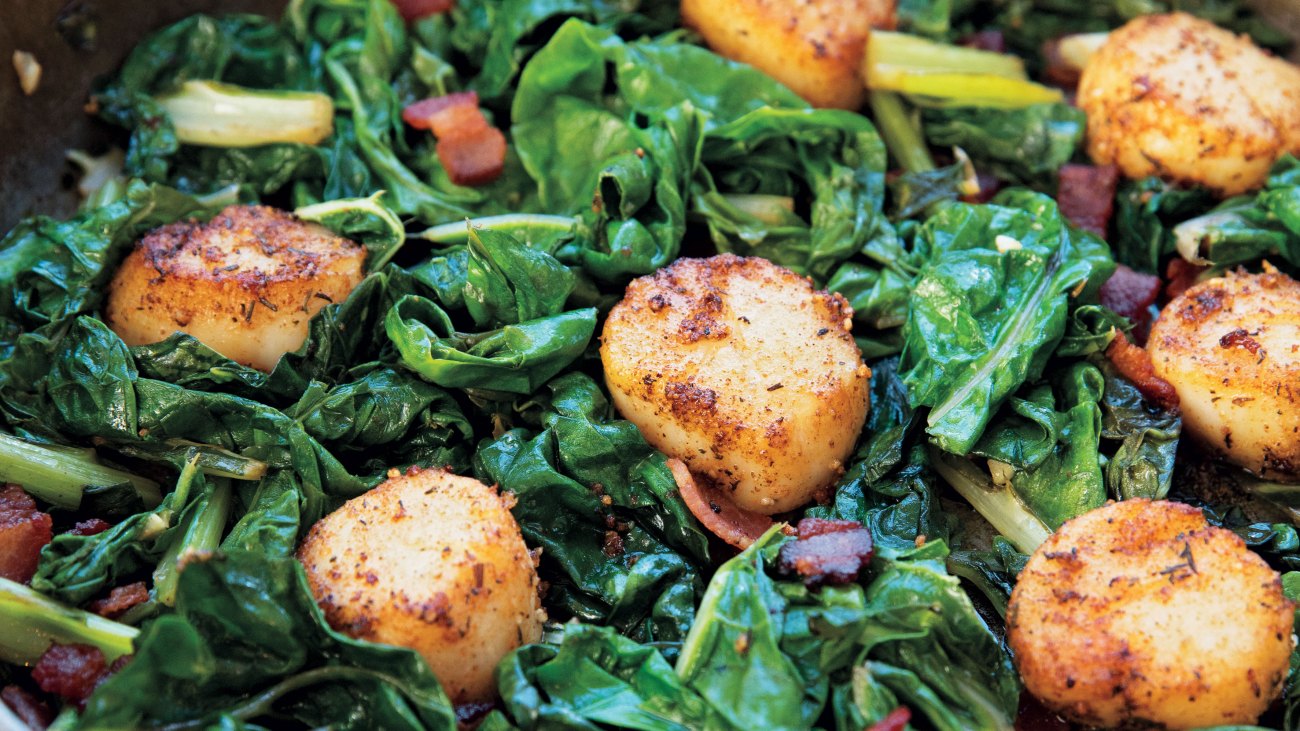 Pan-Seared Scallops with Bacon Over Braised Swiss Chard