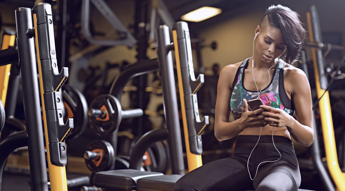 Woman On The Phone In The Gym 