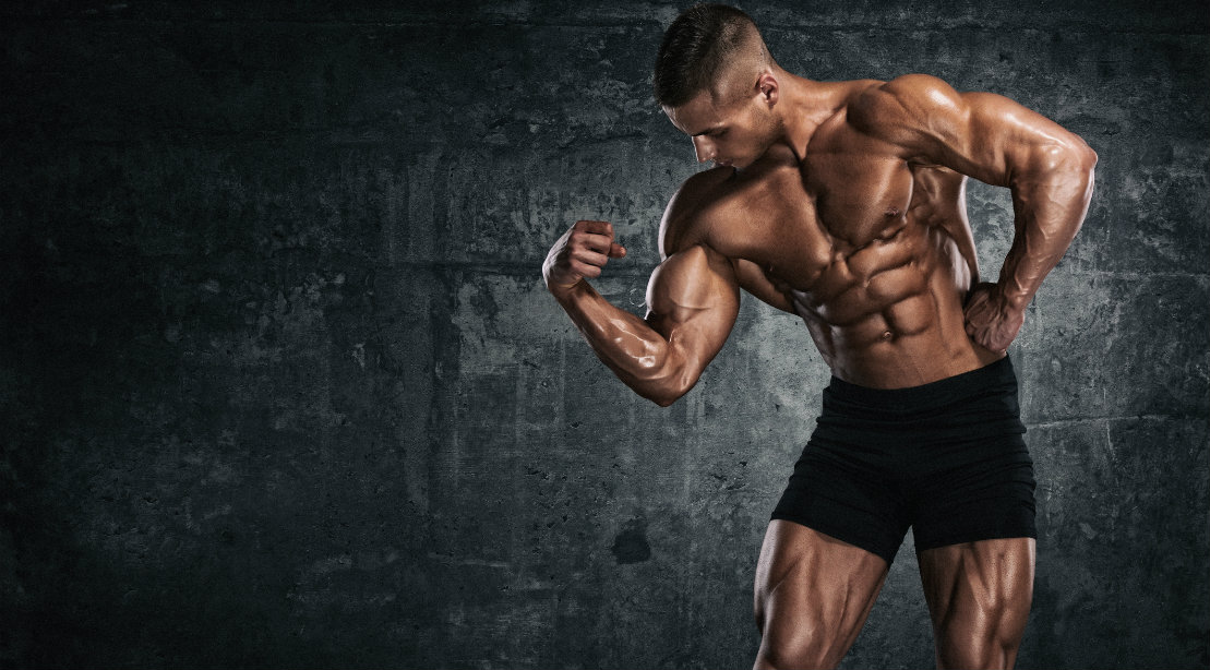 Bodybuilder flexing bicep muscle