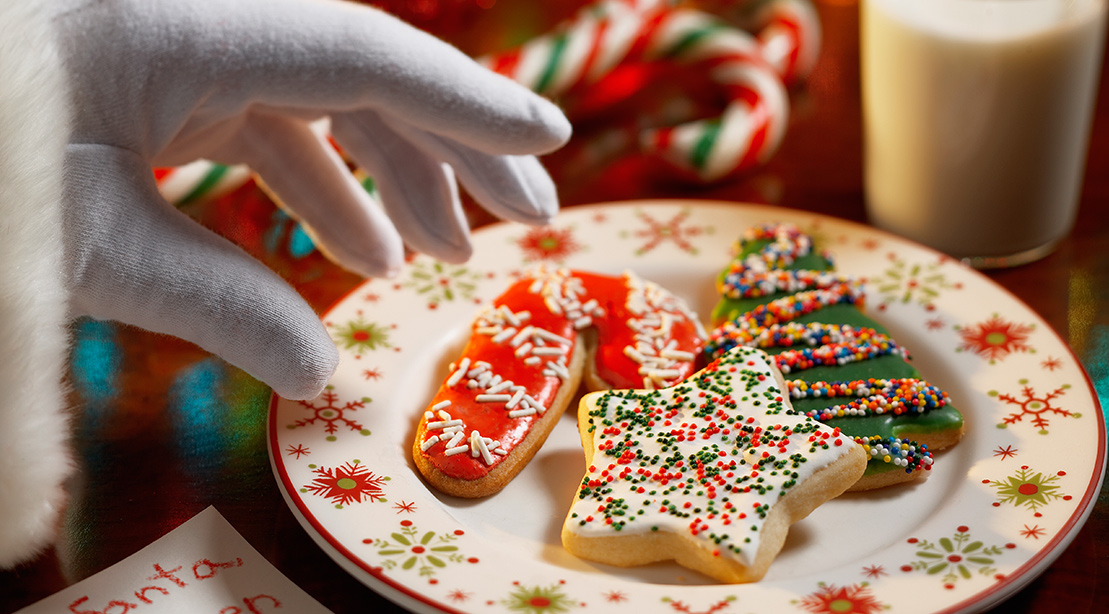 Santa Grabbing Christmas Cookies