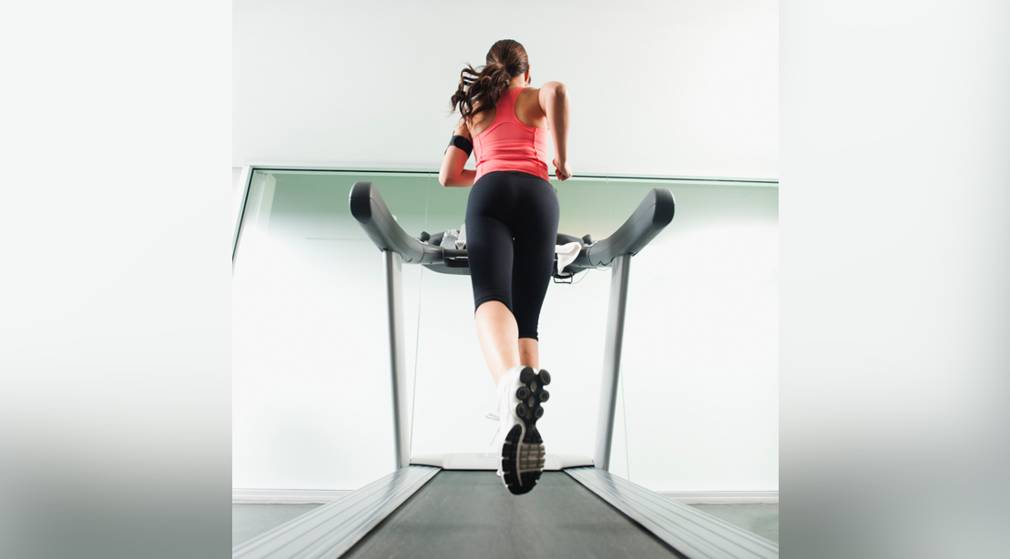 Woman Running on Treadmill