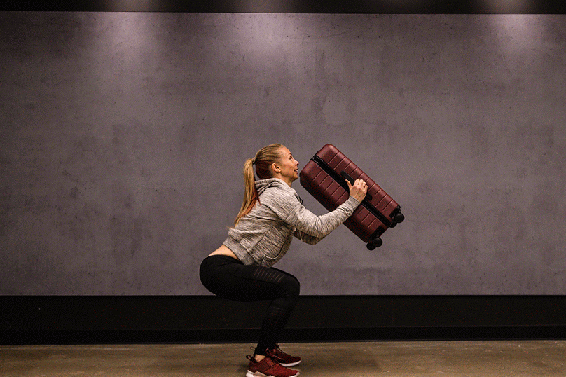 The Suitcase Workout to Keep You on Track While Traveling Muscle