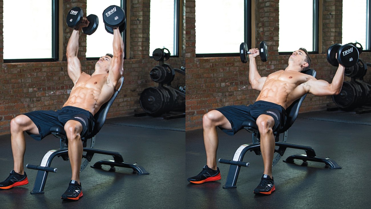 Muscular fit male working out his chest muscles with an incline dumbbell flye chest exercise