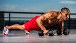 Man doing push-ups with dumbbells