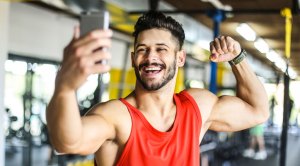 Man taking selfie in gym