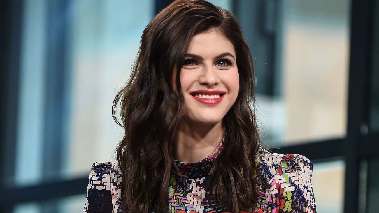 Alexandra Daddario talks heavy lifting, dog-based workouts, and her two-time co-star, The Rock. 