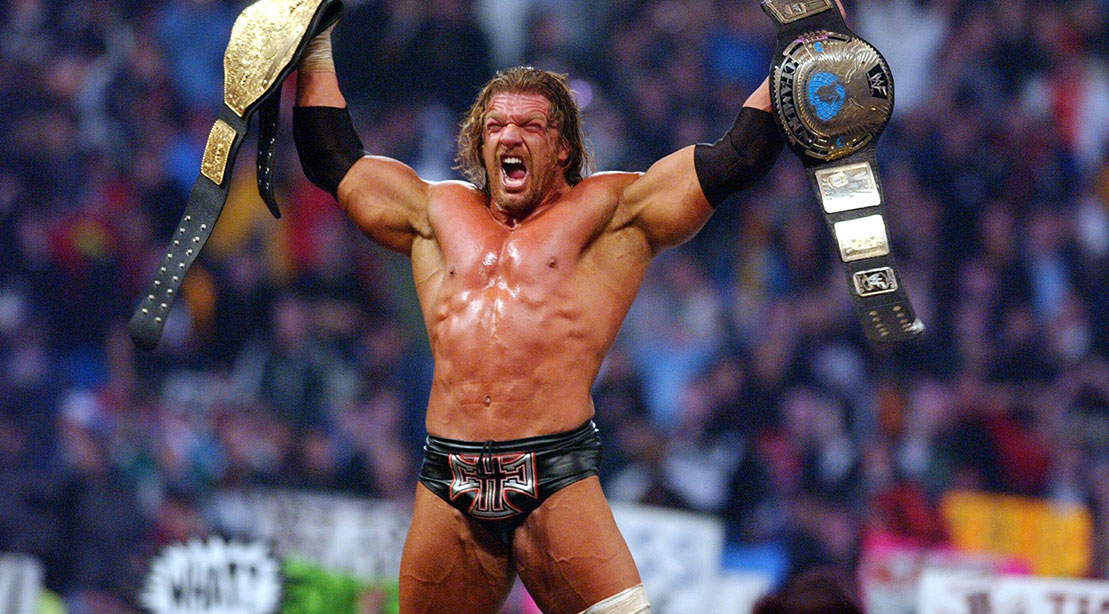 Triple H holding the WWE World Title