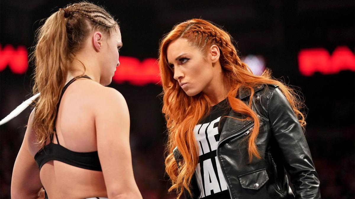 Becky Lynch staring down Ronda Rousey. 