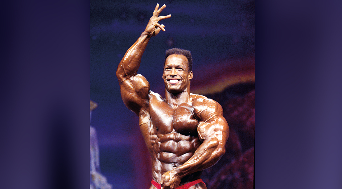Bodybuilder Shawn Ray posing on stage