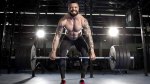 Bodybuilder deadlifting heavy weights and balancing out strength imbalances with unilateral exercises for deadlift