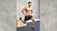 Fitness model working out his lower body with bulgarian split squat exercise