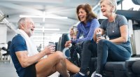 Group of friends past age 40 working out in the gym