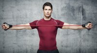 Man performing resistance band workouts