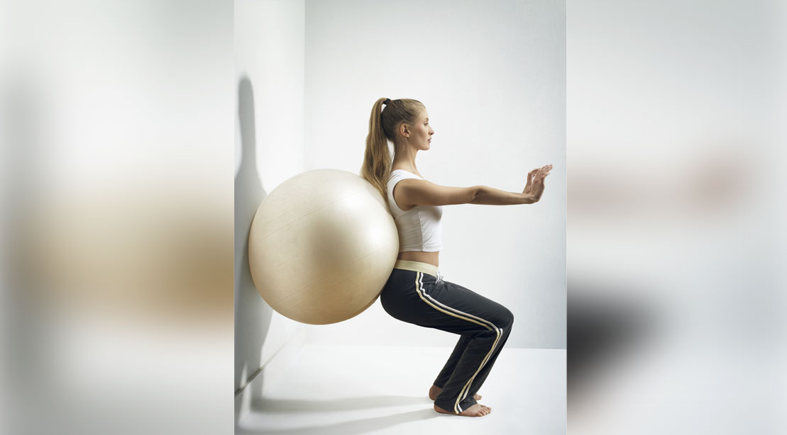 wall-sit-with-exercise-ball-200338797-001 