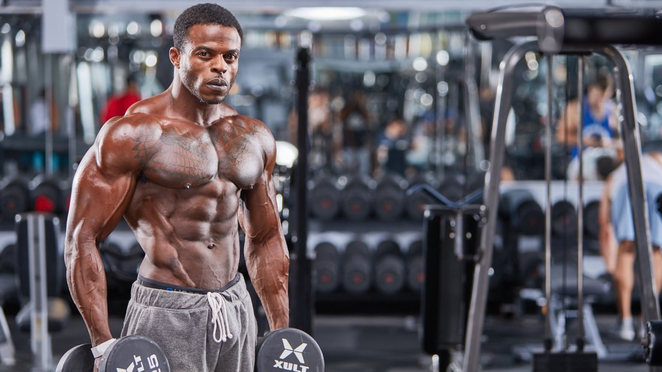 Andre Ferguson posing during his Muscle & Fitness photoshoot 