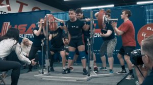 a competition back squat done in knee sleeves