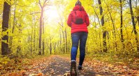 Girl-In-Puffy-Jacket-Walking-Through-Park-Fall-Time