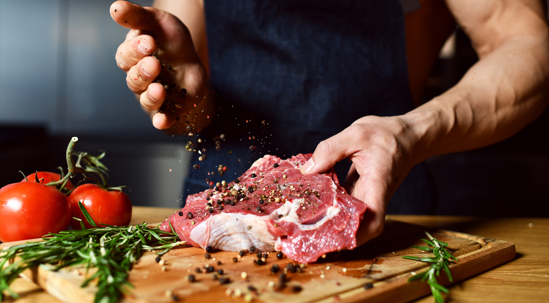 Muscular-Chef-Seasoning-Raw-Meat