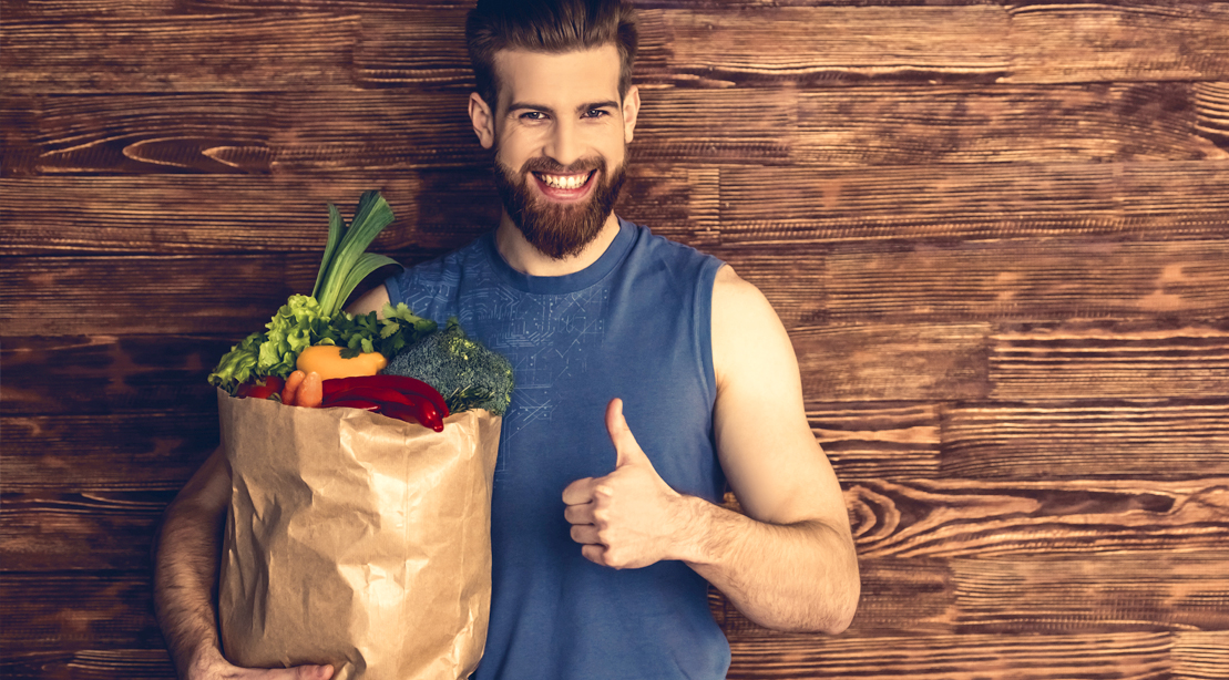 Muscular-Man-Holding-Bag-Of-Groceries