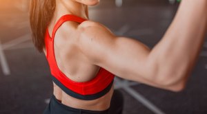 Woman Training Shoulders in the Gym