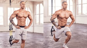 Muscular man performing TRX exercises to strengthen his squat