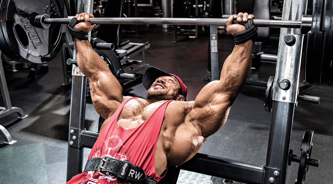 Bodybuilder Roelly Winklar working out his upper body with an incline barbell bench press