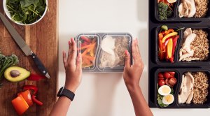 Woman Meal Prepping Healthy Food in the Kitchen