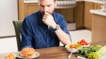 Man-Making-Dietary-Decisions-Burger-Salad