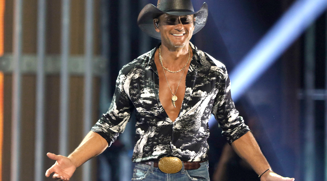 Tim-Mcgraw-Performing-On-Stage-Showing-Chest
