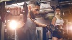 Man and Woman Training with Dumbbells