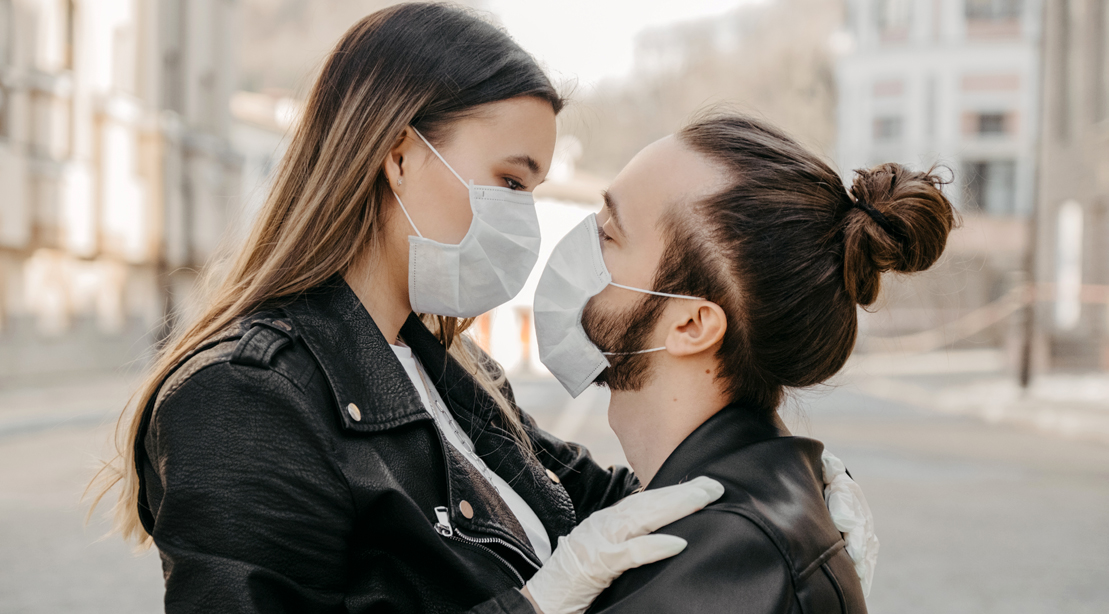 Hip couple wearing face masks under covid-19 pandemic