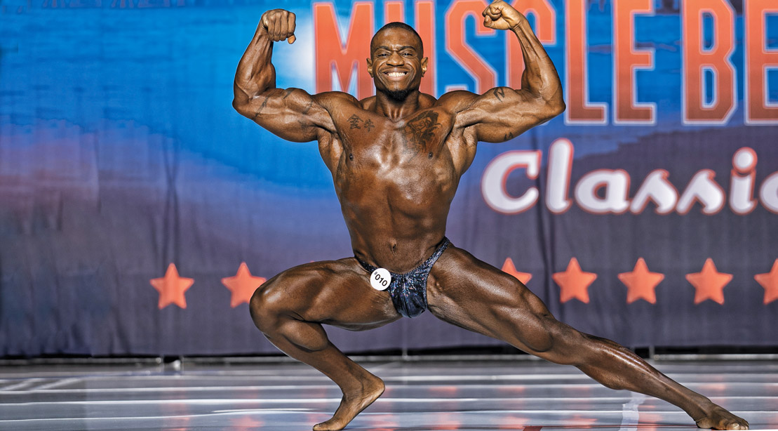 NPC bodybuilder Everett Jolivet posing on bodybuilding stage