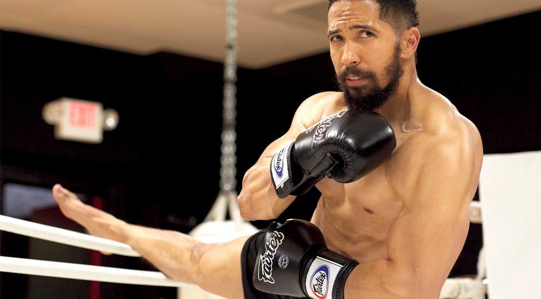 Actor Neil Brown Jr stretching his legs in a boxing ring