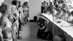 Female bodybuilders in the 70's lining up to be judged in a female bodybuilding competition