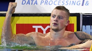 Olympic Gold Medal Swimmer Adam Peaty in an olympic swimming pool looking strong
