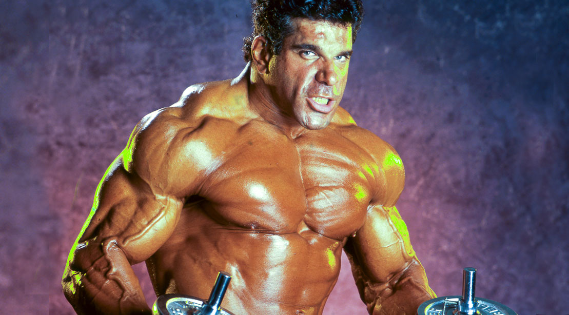 Lou Ferrigno the actor who played Marvel's TV Show The Hulk posing in the gym with dumbbells
