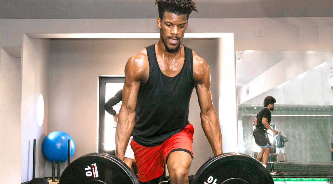 NBA basketball player Jimmy Butler working out his arms with landmine rows exercise