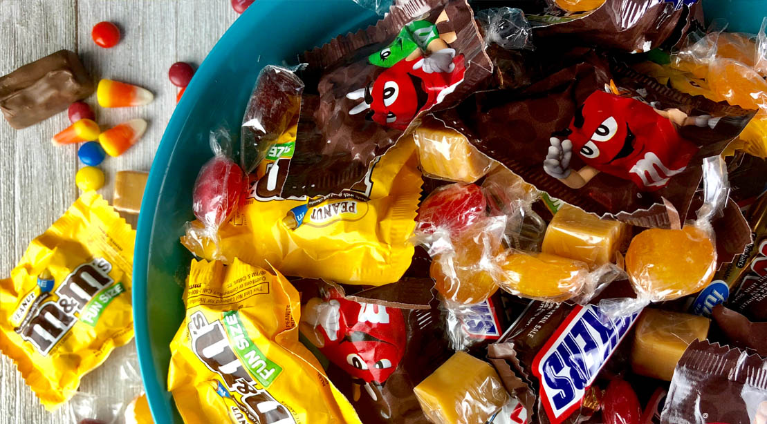 A bowl full of chocolate candies and Mars chocolates