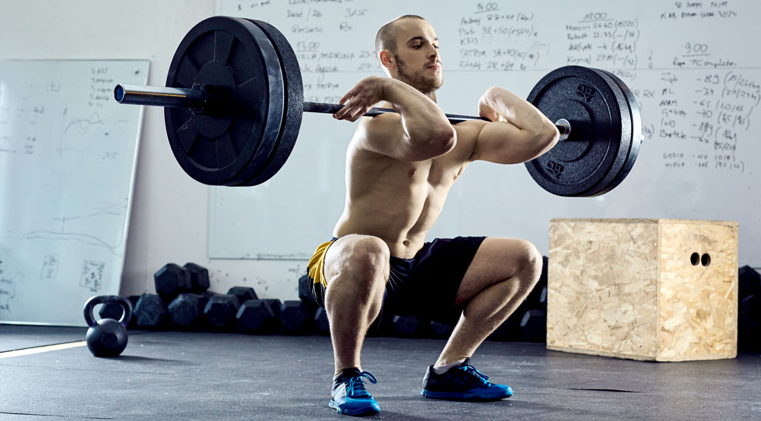 Skinny man performing a front squat and front squat variations